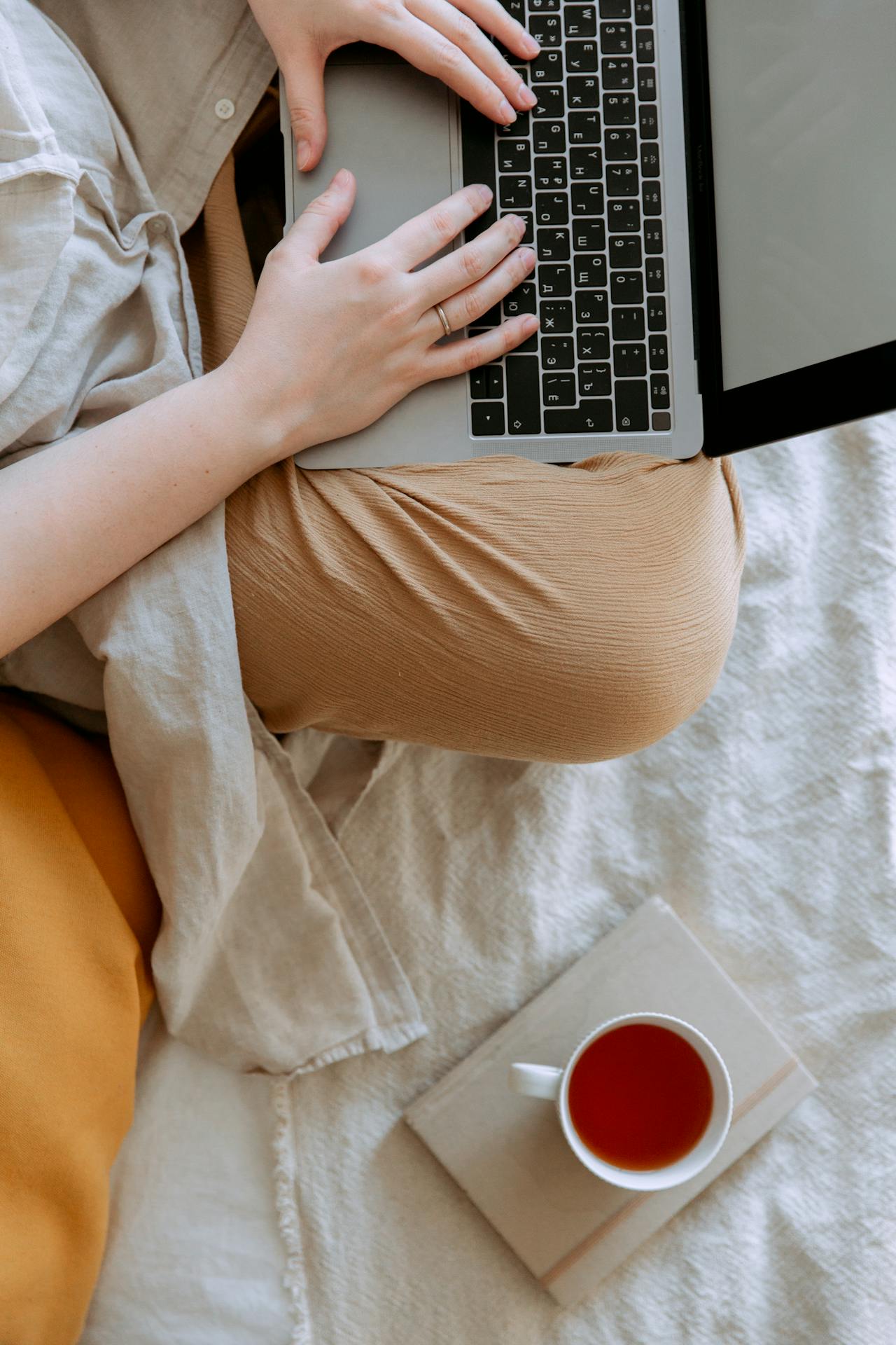 Girl working on laptop in a relaxed context.